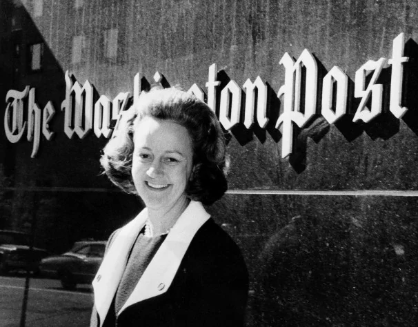 Katharine Graham, in front of her family business