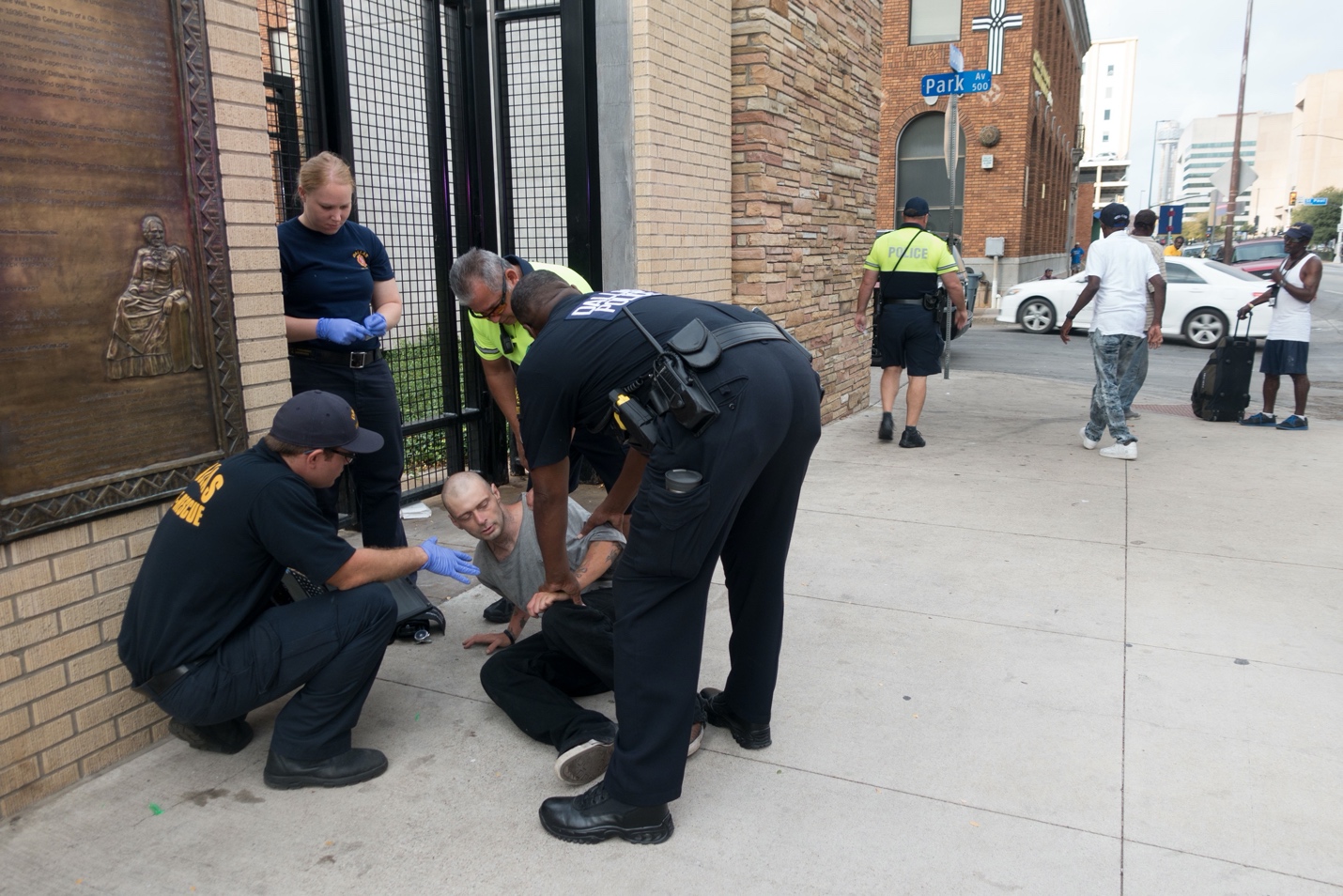 Police officers helping a person to get injured

Description automatically generated