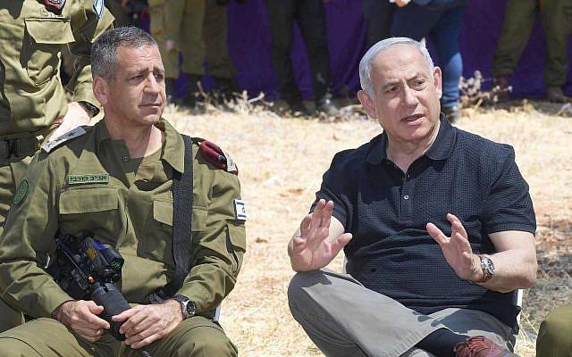 Prime Minister Benjamin Netanyahu and IDF Chief of Staff Aviv Kohavi attend a drill in northern Israel in June 2019. (Amos Ben Gershom/GPO)