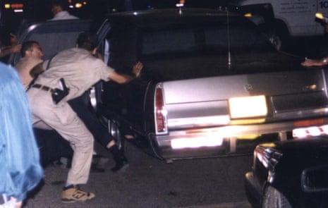 Security personnel bundle Yitzhak Rabin into his car after he was shot at a peace rally in Tel Aviv on
4 November 1995