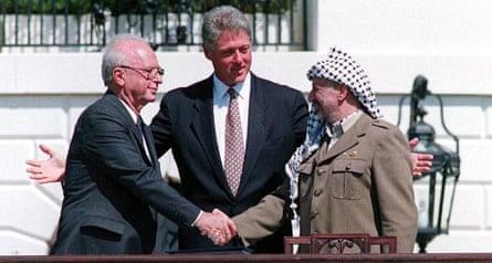 Yitzhak Rabin and Palestinian leader Yasser Arafat with President Clinton, sealing the Oslo accords with a handshake, in September 1993 on the White House lawn