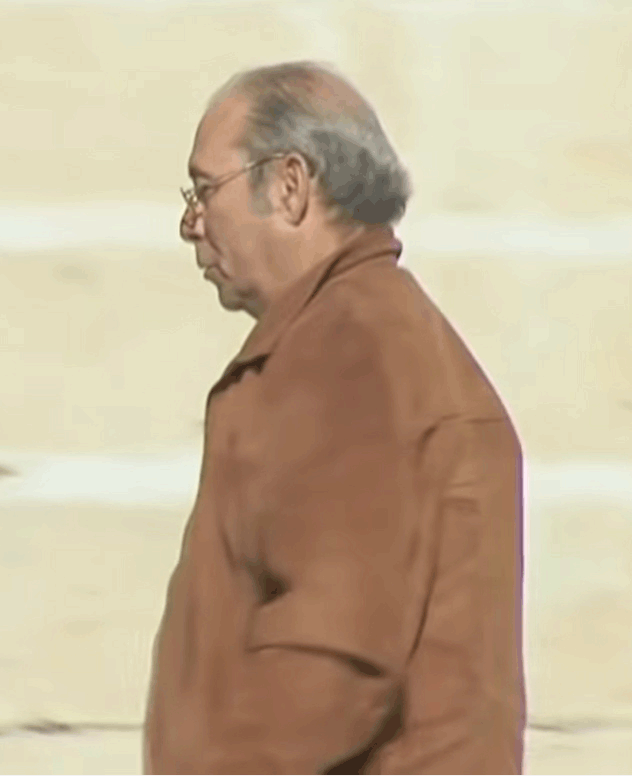 A person in a brown coat

Description automatically generated