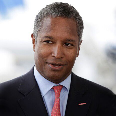 A person in a suit and tie

Description automatically generated