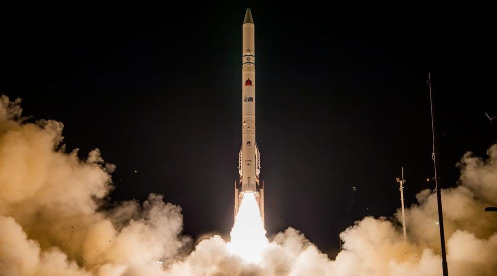 A rocket taking off from space
Description automatically generated