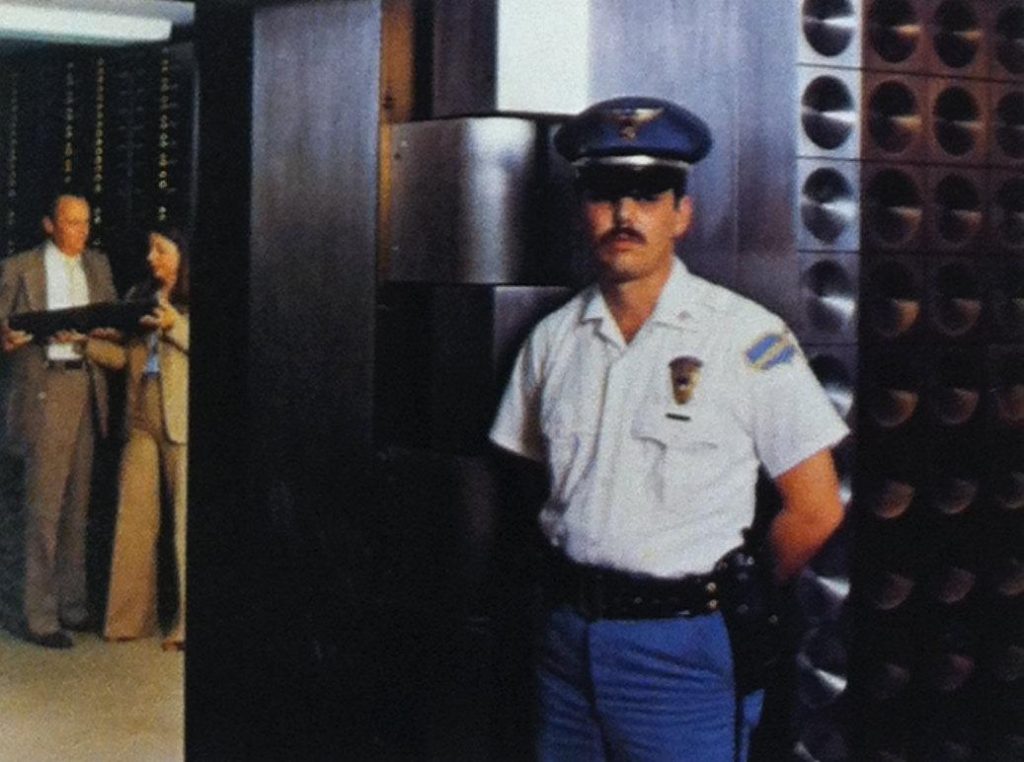 A Wackenhut security officer standing guard at a bank.