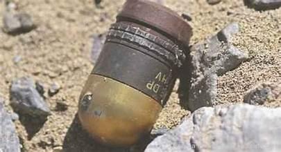A close-up of a bullet

Description automatically generated