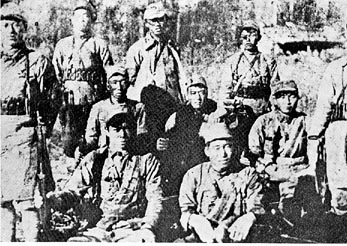 A group of men in military uniforms
Description automatically generated