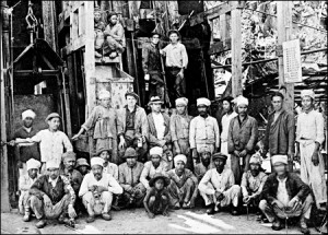 A group of men posing for a photo
Description automatically generated
