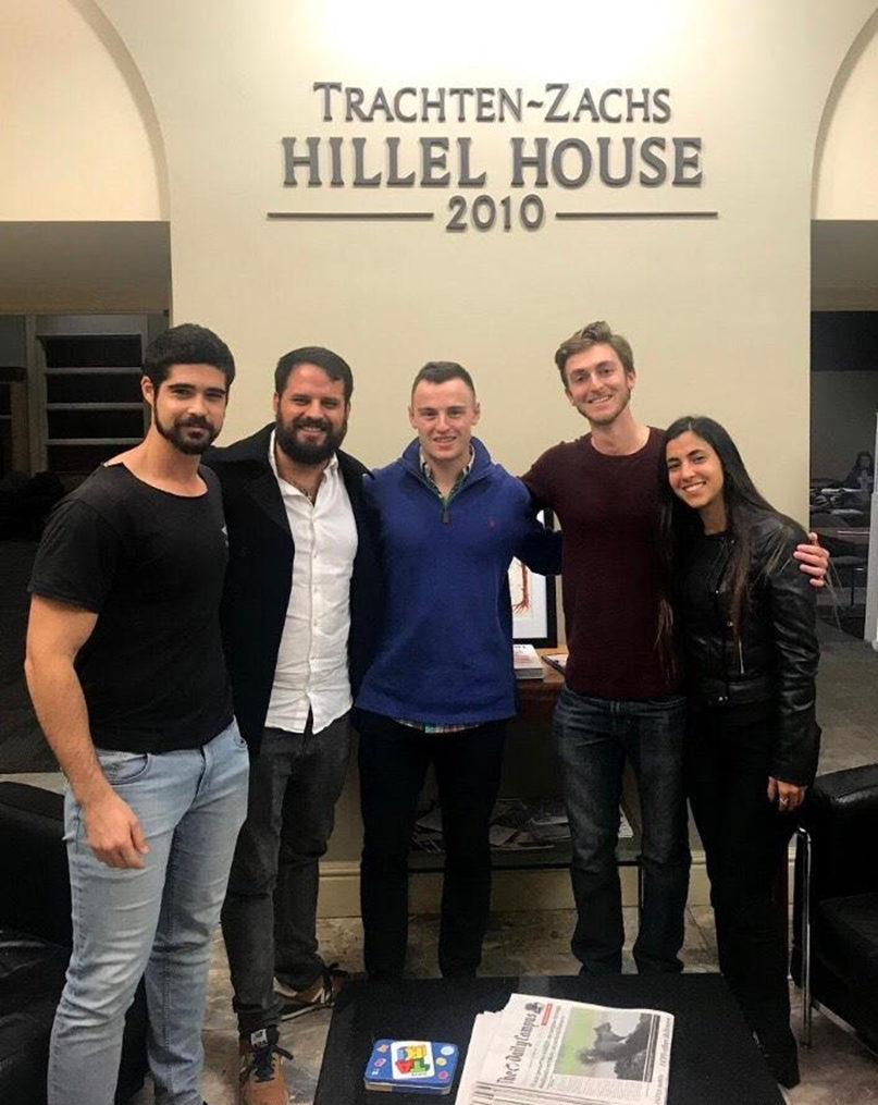 A group of people posing for a photo

Description automatically generated