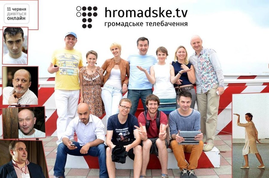 A group of people posing for a photo

Description automatically generated