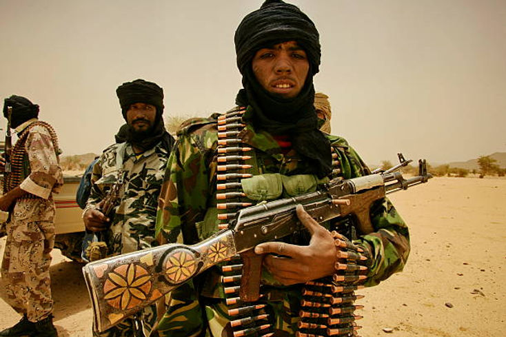A group of soldiers in military uniforms holding guns
Description automatically generated