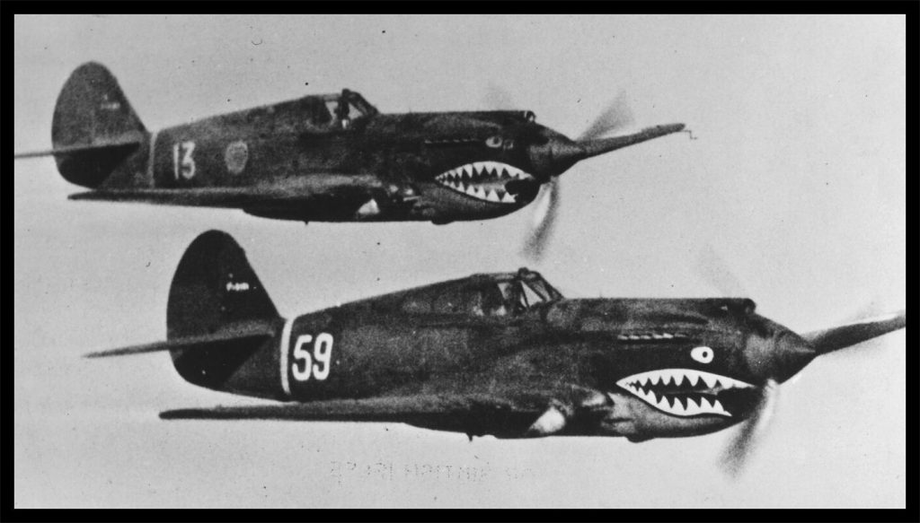 A pair of planes with teeth painted on them

Description automatically generated