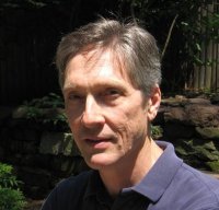 A person in a blue shirt Description automatically generated