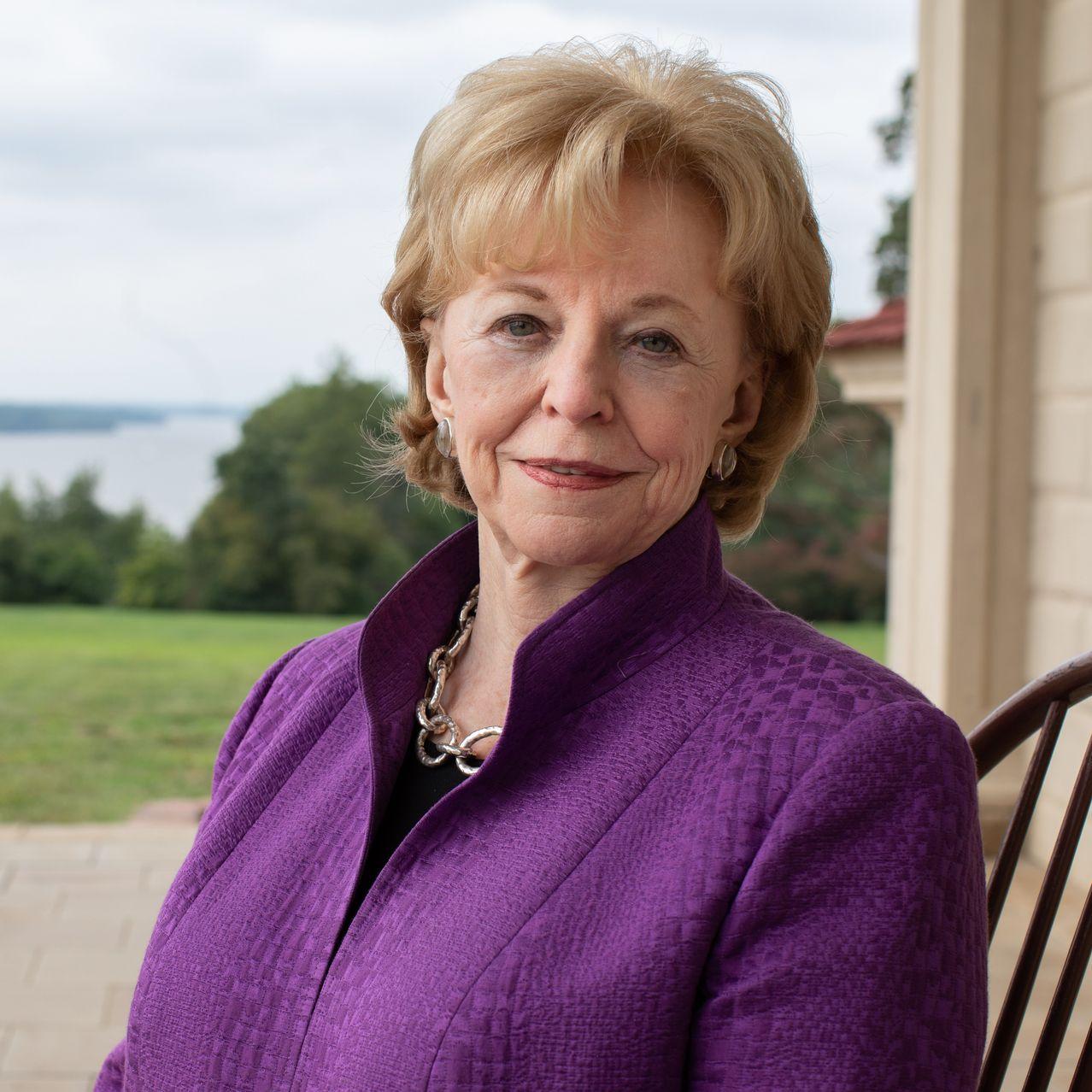 A person in a purple jacket

Description automatically generated