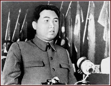 A person in uniform sitting at a podium

Description automatically generated