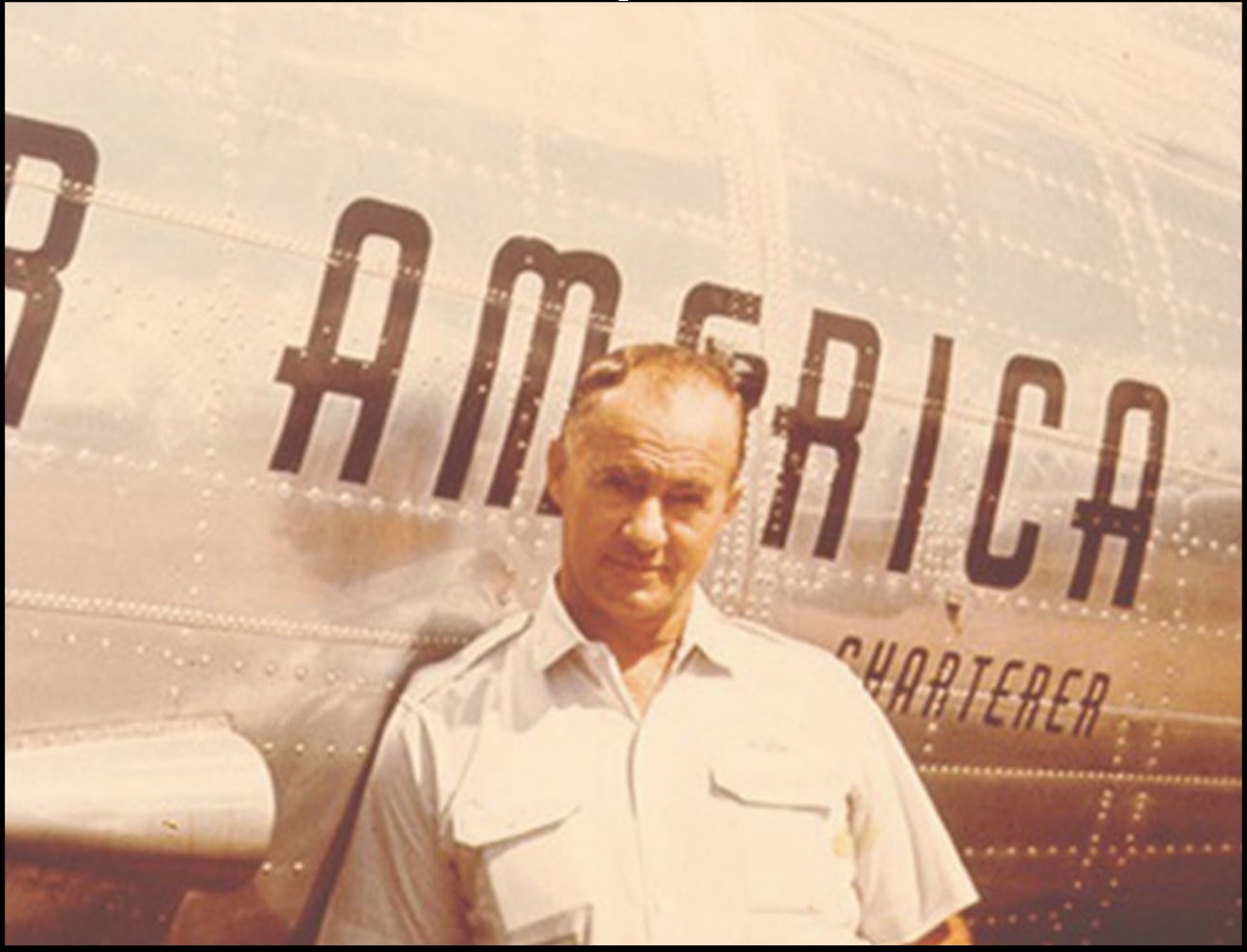 A person standing next to a plane

Description automatically generated