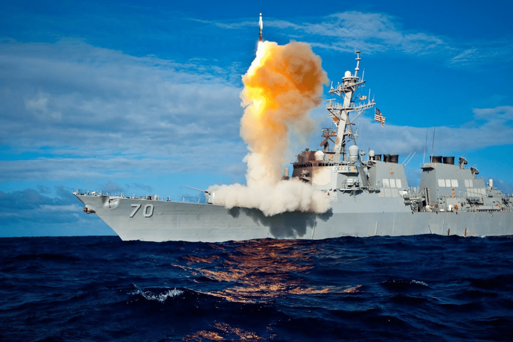 A ship firing a missile

Description automatically generated