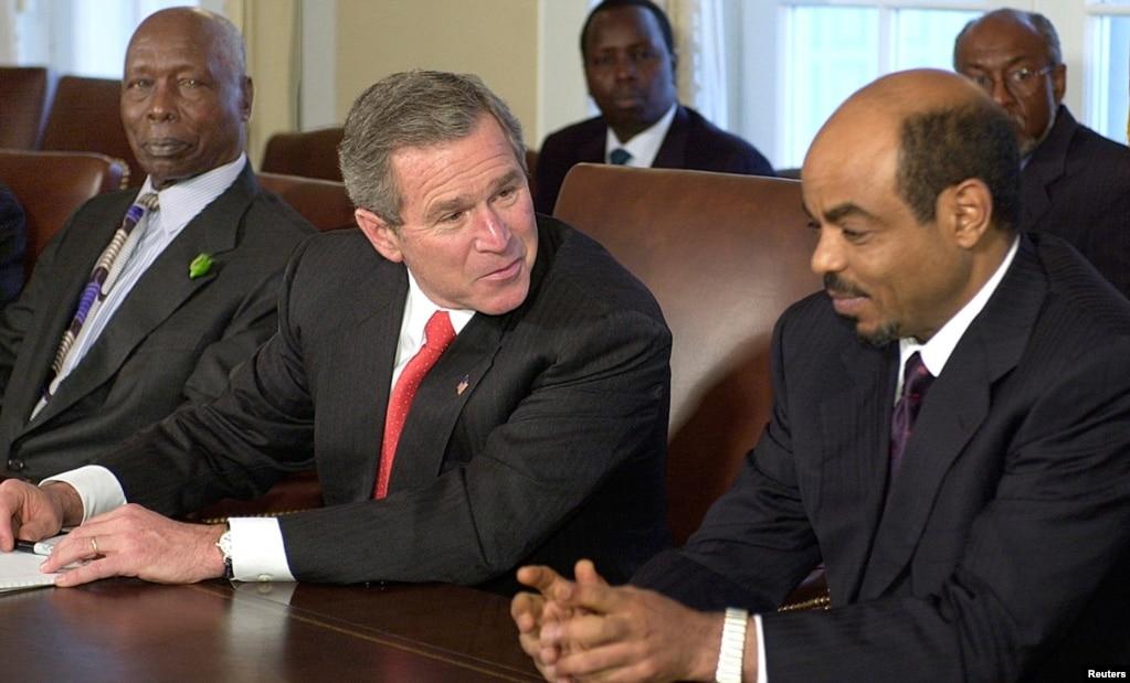 U.S. President George W. Bush chats with Meles during a meeting with Kenyan President Daniel Arap Moi for talks on combatting international terrorism, the White House, Washington, December 5, 2002. 
