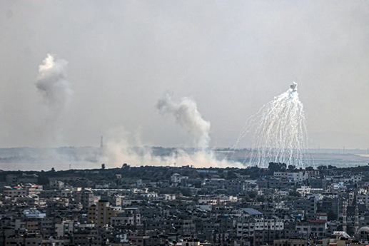 A city with smoke coming out of it Description automatically generated