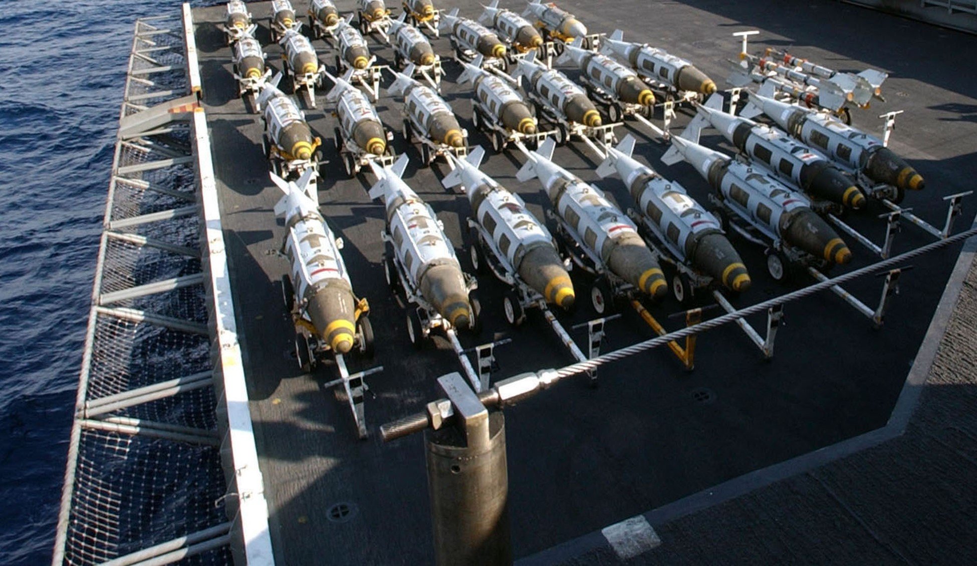 A group of bombs on a ship

Description automatically generated