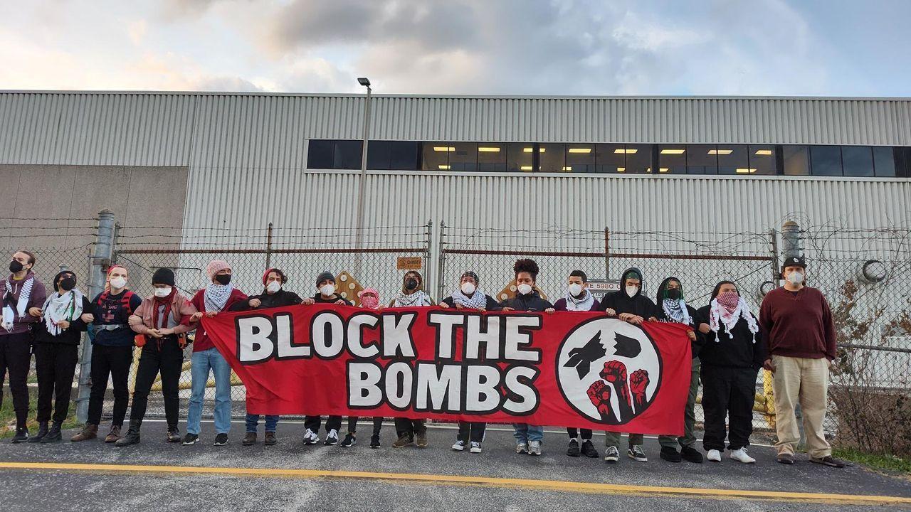 A group of people holding a banner

Description automatically generated