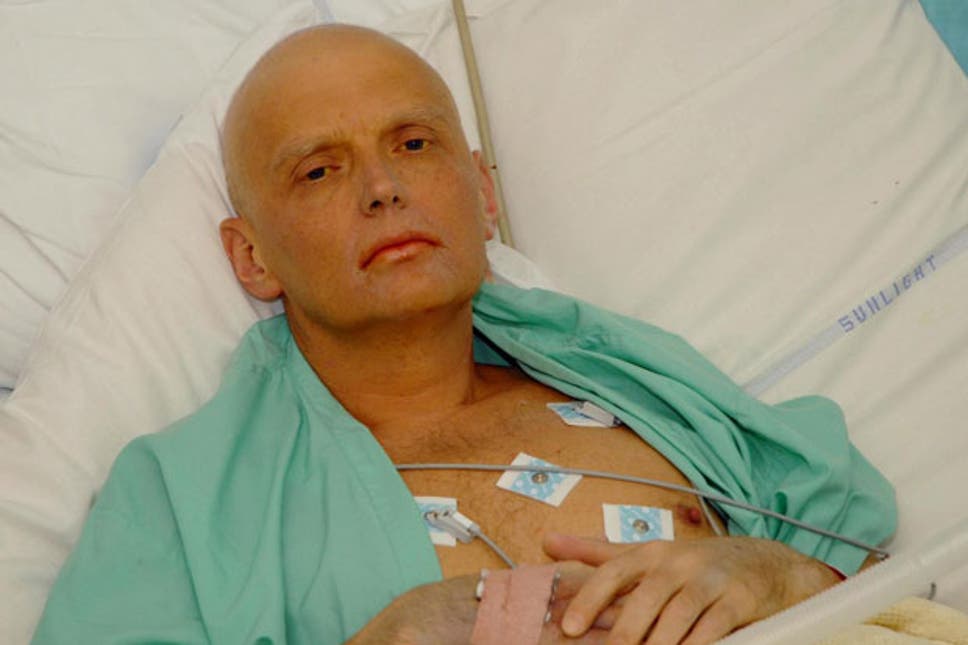 A person in a hospital bed with tags on his chest

Description automatically generated