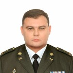A person in a military uniform

Description automatically generated