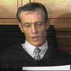 A person in a suit
Description automatically generated with medium confidence