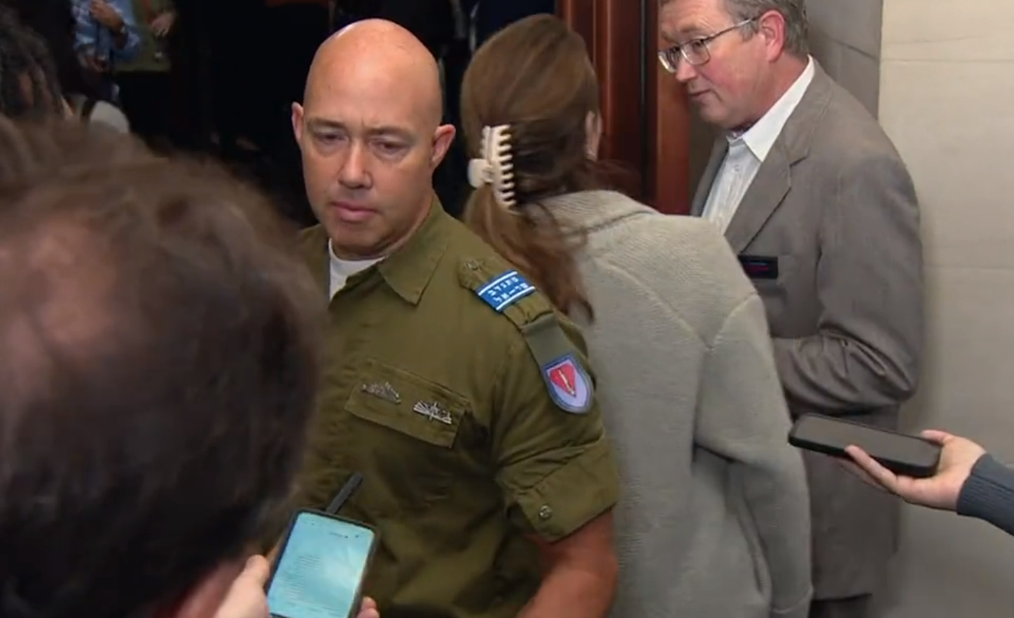 A person in a uniform

Description automatically generated