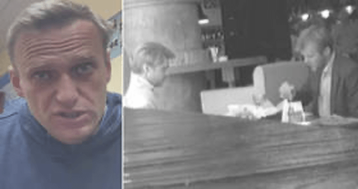 A person looking at camera Description automatically generated