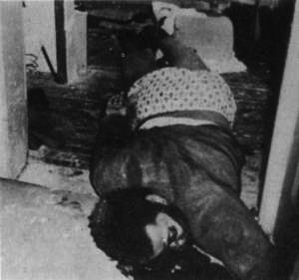 A person lying on the ground

Description automatically generated