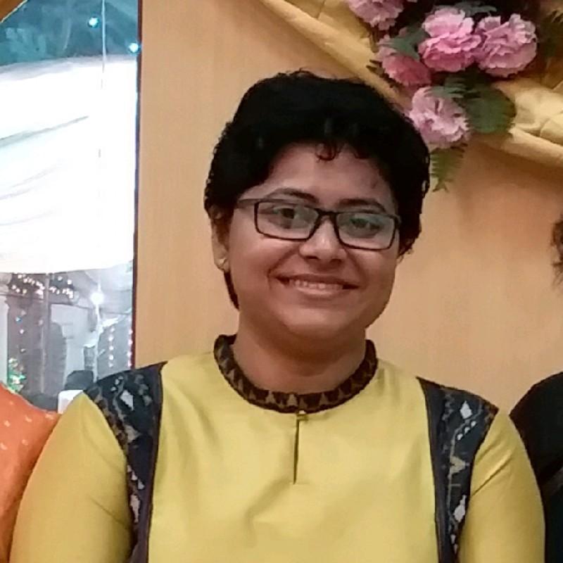 A person smiling at the camera

Description automatically generated