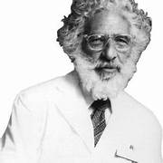 A person with a beard and glasses

Description automatically generated