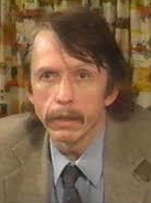 A person with a mustache
Description automatically generated with medium confidence