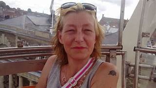 A person with sunglasses on her head

Description automatically generated