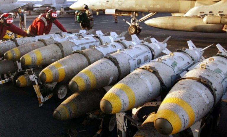 A group of bombs on a runway

Description automatically generated