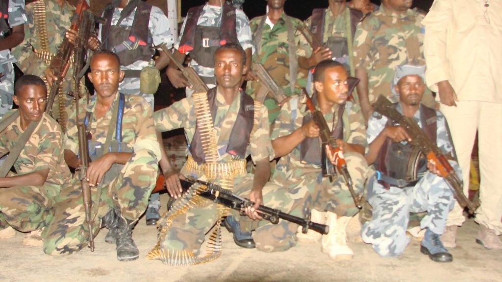 A group of soldiers holding guns

Description automatically generated
