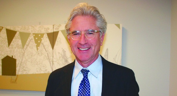 A person in a suit and tie
Description automatically generated