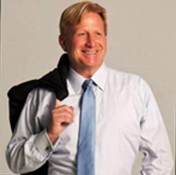 A person in a white shirt and tie

Description automatically generated