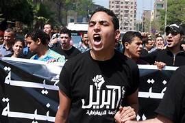 A person shouting in front of a crowd of people

Description automatically generated
