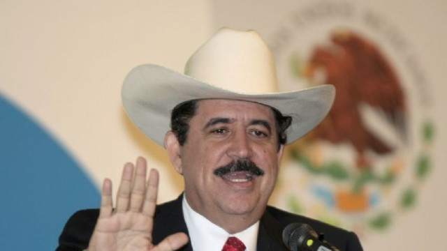 A person wearing a hat and holding his hands up Description automatically generated with medium confidence