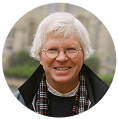A person wearing glasses and a scarf

Description automatically generated
