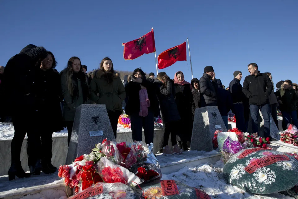 Kosovo Albanians gather to pay their respects to their relatives and victims of the Racak massacre in the village of Racak, Kosovo on Tuesday, Jan. 15, 2019. Kosovo Albanians gathered in the village of Racak on Thursday to mark the 20th anniversary of the massacre of more than 40 ethnic Albanians by Serb security forces. (AP Photo/Visar Kryeziu)