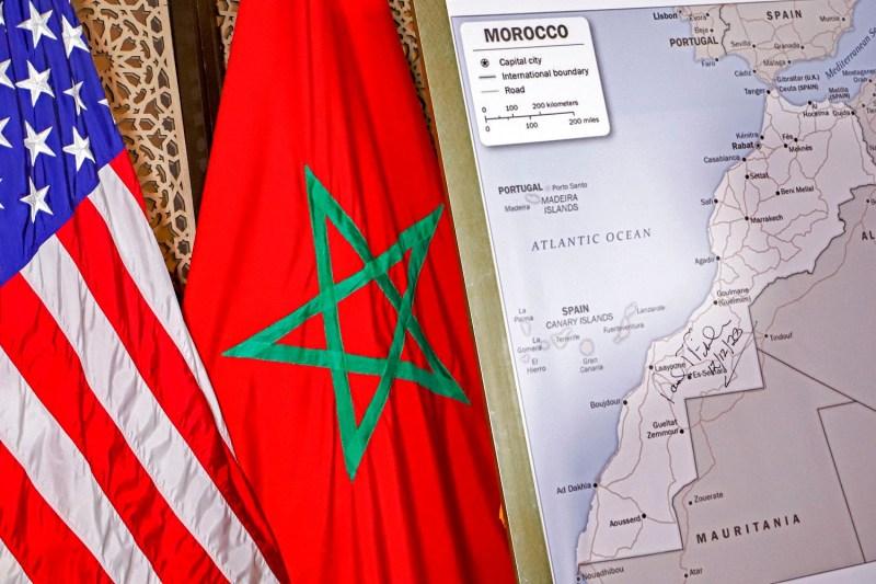 The U.S. and Moroccan and flags beside a State Department-authorized map of Morocco, including disputed Western Sahara, in Rabat on Dec. 12.