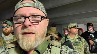 A group of men in military uniforms

Description automatically generated