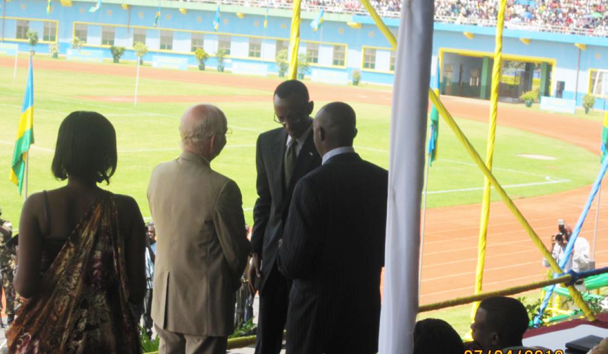 A group of men standing in a stadium

Description automatically generated