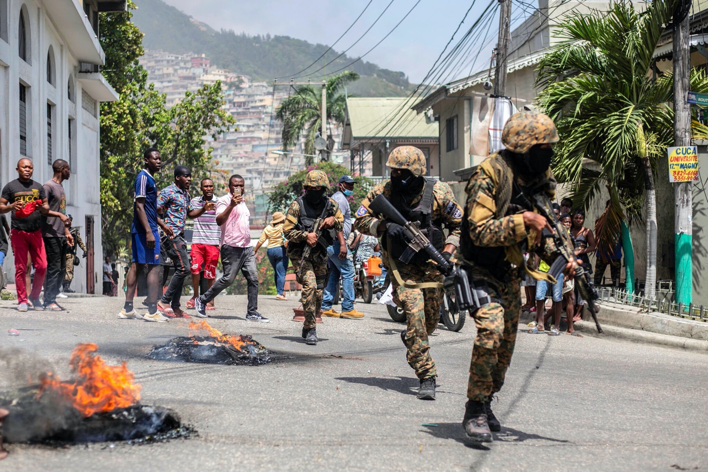A group of soldiers running on a street

Description automatically generated