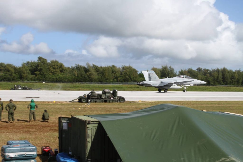 A military vehicle on the runway

Description automatically generated