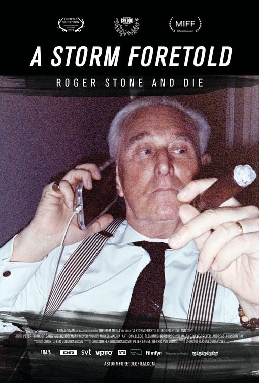A person holding a cigar and talking on the phone

Description automatically generated