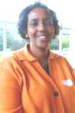 A person in an orange shirt

Description automatically generated